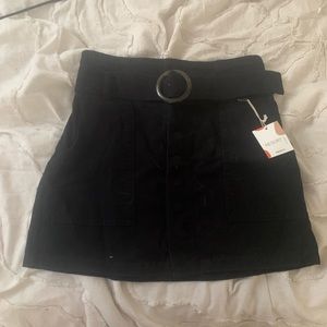 Forever 21 belted black mini skirt, tortoiseshell print belt buckle.
